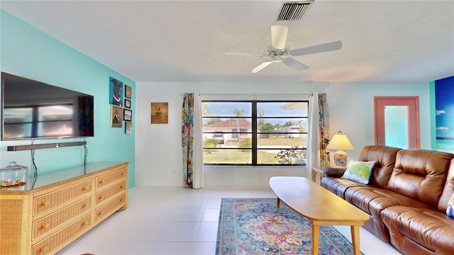 living room with ceiling fan and light tile patterned floors