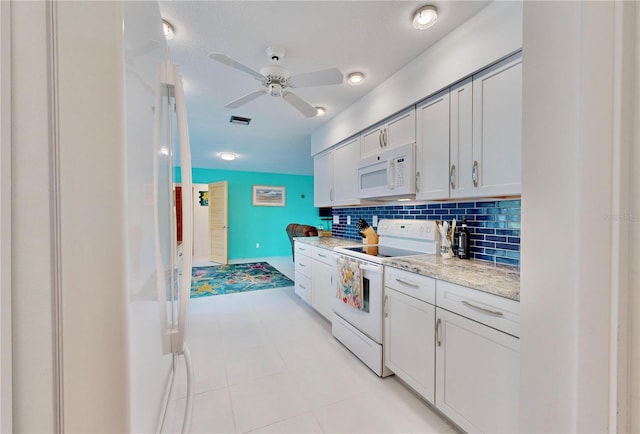 kitchen with tasteful backsplash, white cabinetry, light stone counters, and white appliances