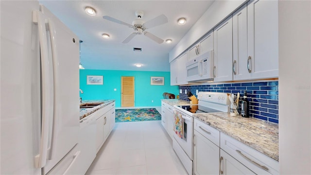 kitchen featuring white cabinetry, ceiling fan, light stone counters, white appliances, and decorative backsplash