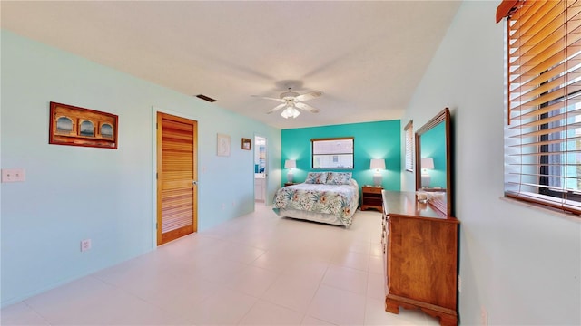 bedroom featuring ceiling fan and a closet