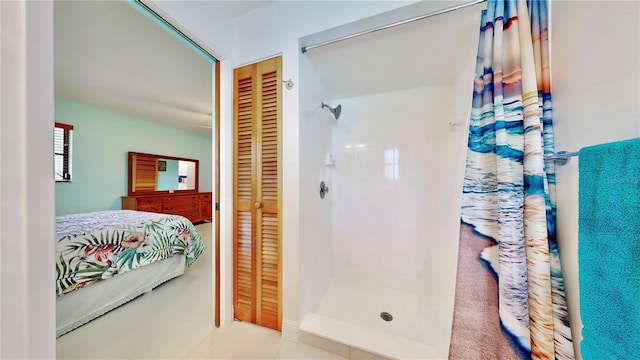 bathroom featuring tile patterned flooring and a shower with curtain