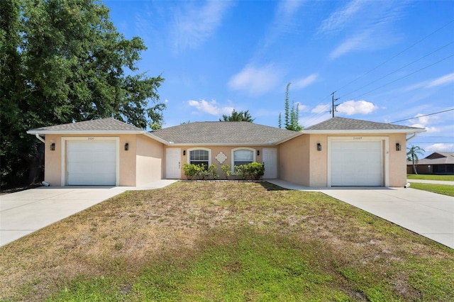 ranch-style house with a garage and a front lawn