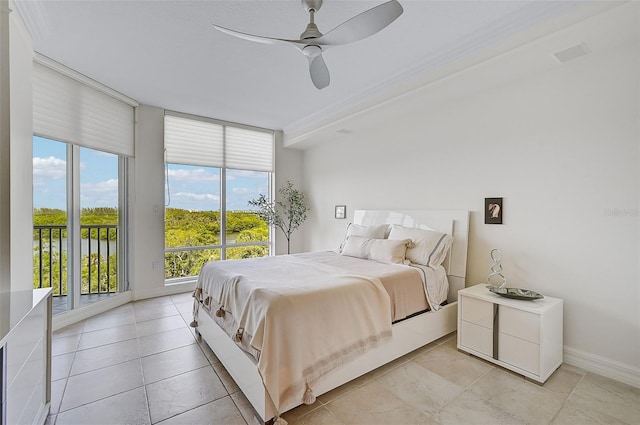 tiled bedroom with ceiling fan and access to outside