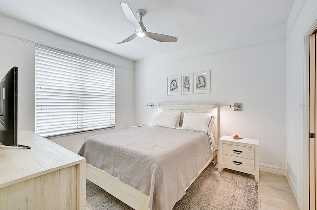 tiled bedroom with ceiling fan