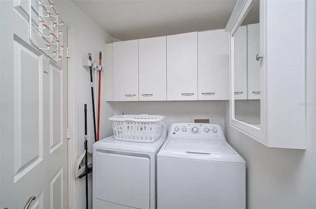 washroom featuring cabinets, separate washer and dryer, and washer hookup