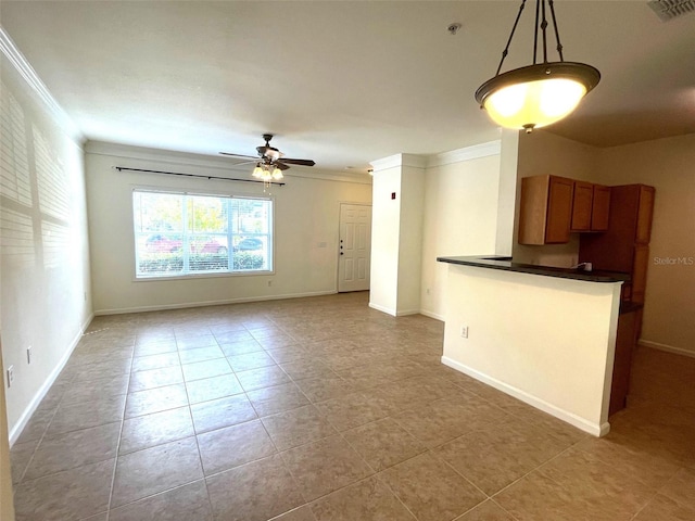 unfurnished living room featuring ceiling fan, light tile patterned flooring, and ornamental molding