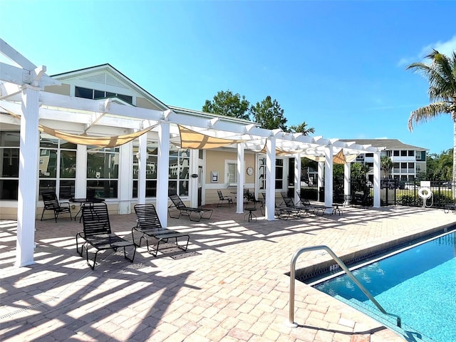 exterior space featuring a pergola, a patio, and a fenced in pool