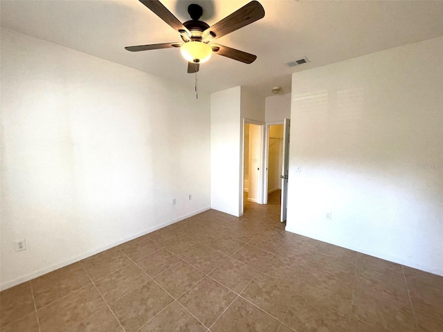 spare room with ceiling fan