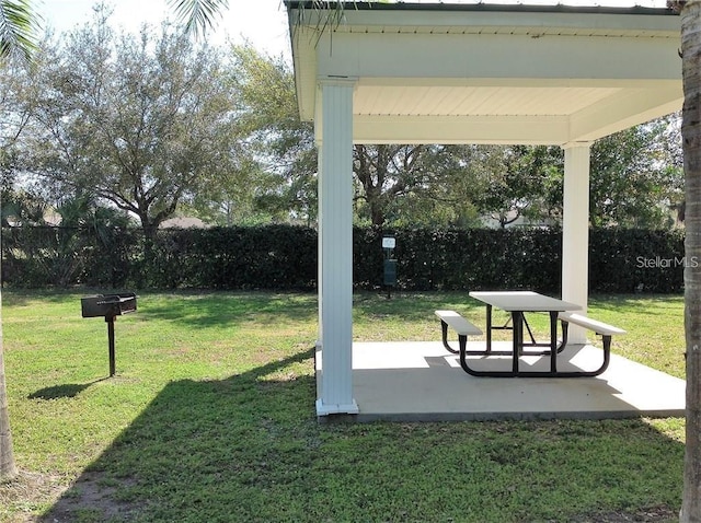 view of community with a patio area and a yard