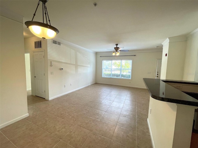 interior space featuring ceiling fan and crown molding