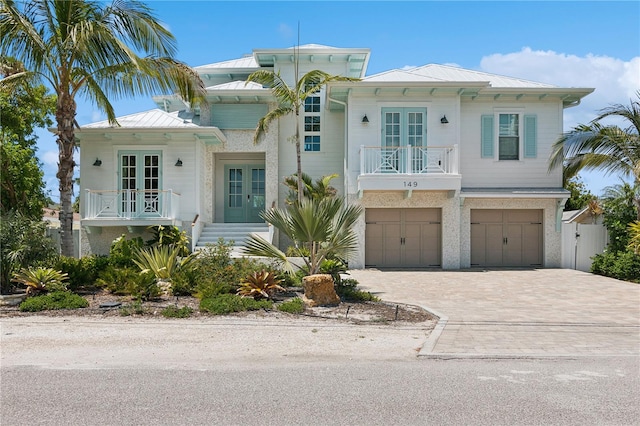 view of front facade featuring a garage and french doors