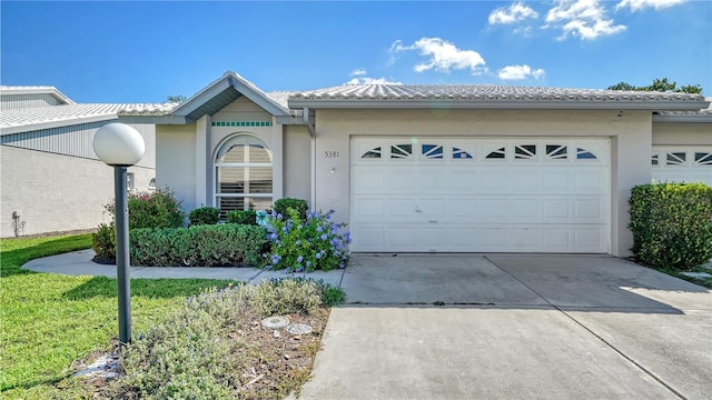 view of front of property with a garage