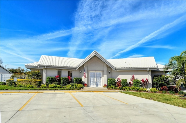 ranch-style house with french doors