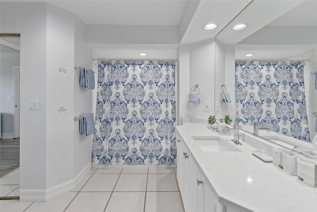 bathroom featuring tile patterned floors, vanity, and a shower with shower curtain