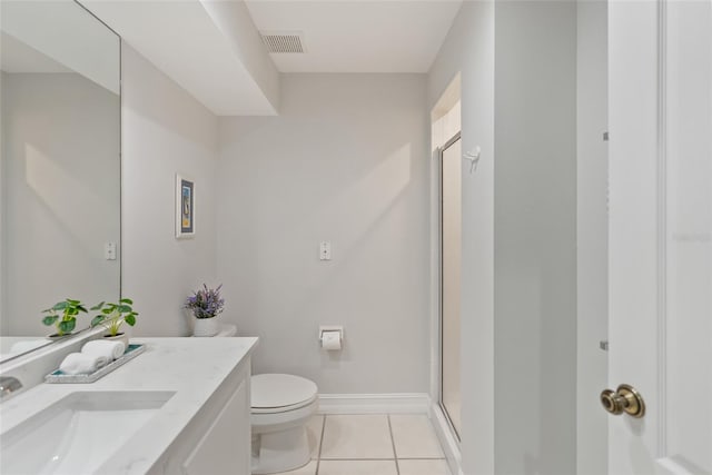 bathroom with a shower with door, toilet, tile patterned floors, and vanity