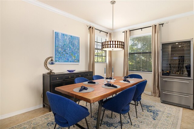 dining space featuring crown molding and tile flooring