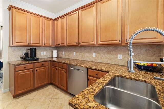 kitchen with stone counters, tasteful backsplash, light tile floors, and stainless steel dishwasher