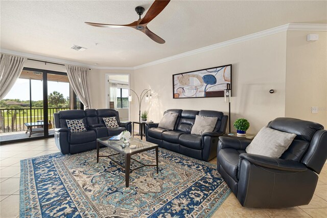 tiled living room with crown molding and ceiling fan