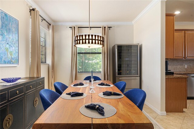 dining room featuring light tile flooring and ornamental molding