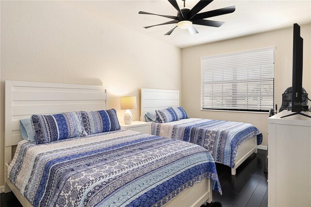 bedroom with hardwood / wood-style flooring and ceiling fan