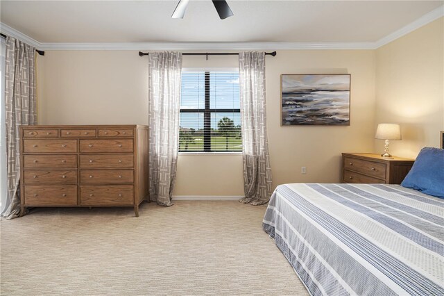 bedroom with ceiling fan, carpet flooring, and crown molding