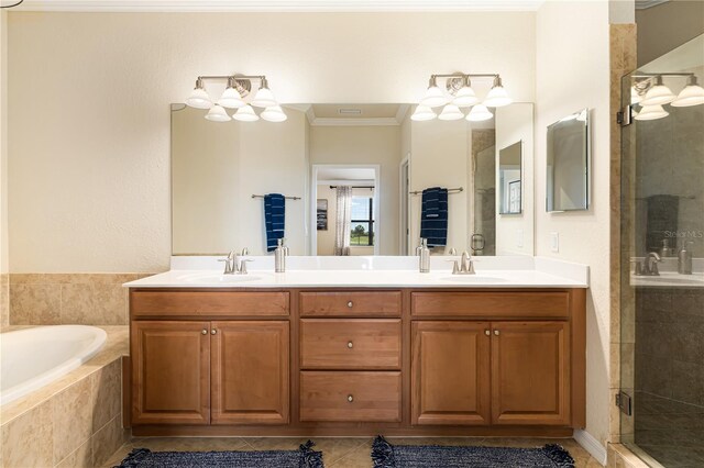 bathroom featuring crown molding, double vanity, shower with separate bathtub, tile floors, and an inviting chandelier