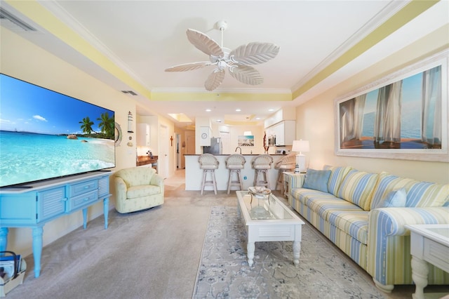 living room featuring ceiling fan and ornamental molding