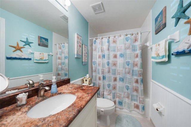 full bathroom featuring vanity, toilet, and shower / bath combo with shower curtain