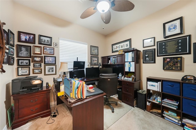 carpeted office with ceiling fan