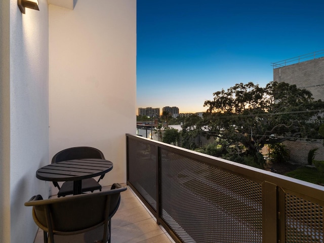 view of balcony at dusk