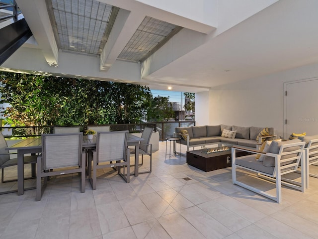 view of patio featuring an outdoor living space with a fire pit