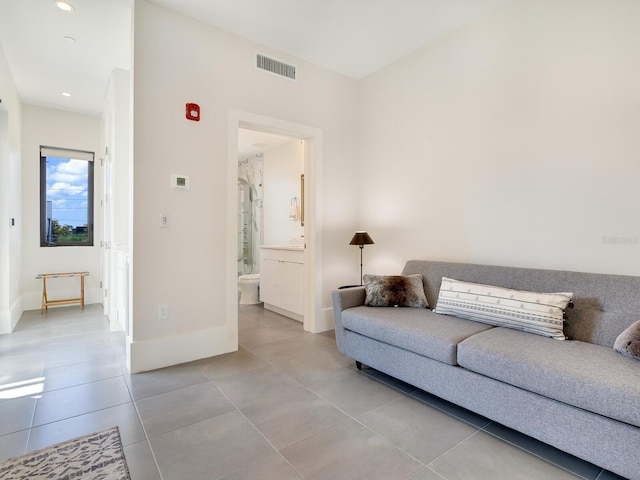 living room with light tile patterned flooring