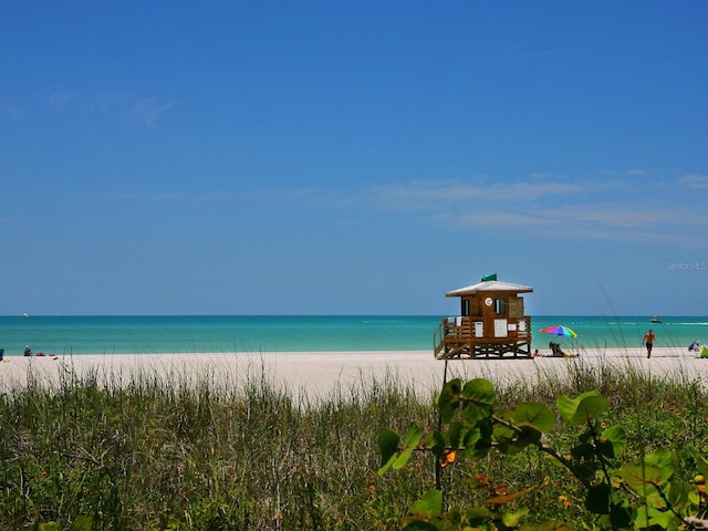 property view of water featuring a beach view