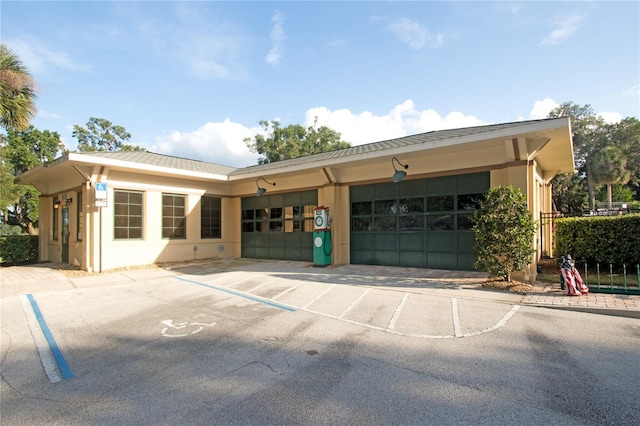 single story home featuring a garage