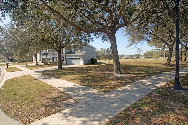 exterior space with a garage and a front yard