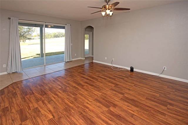 spare room with hardwood / wood-style floors and ceiling fan