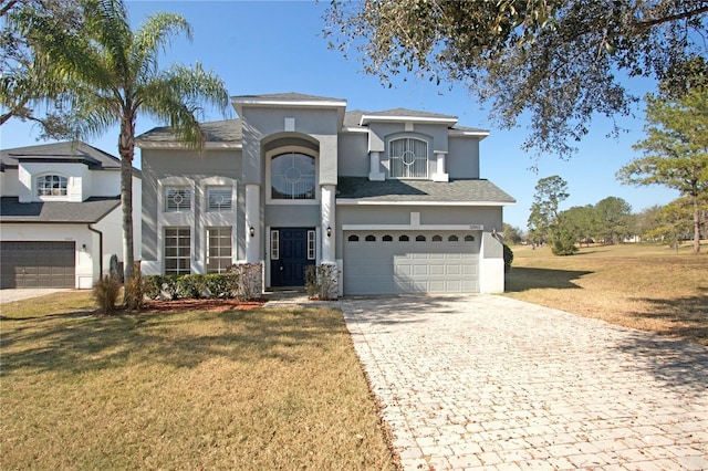 view of front of house featuring a garage and a front yard