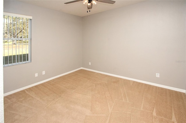 carpeted empty room with ceiling fan