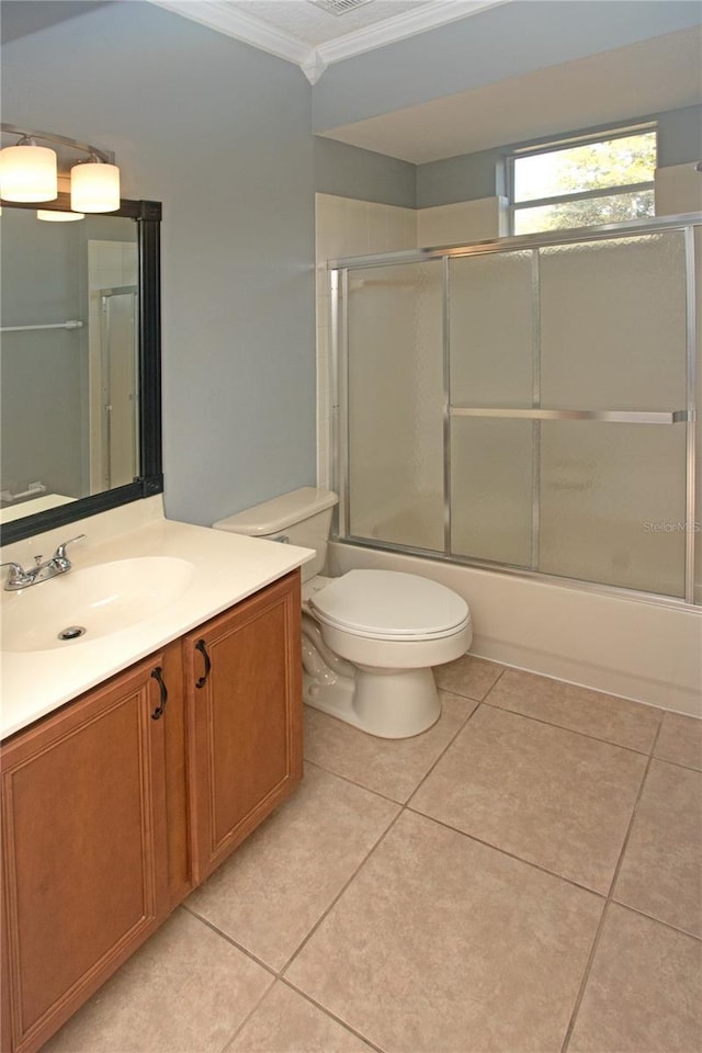 full bathroom with crown molding, vanity, combined bath / shower with glass door, and tile patterned flooring