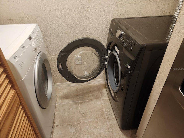 washroom featuring independent washer and dryer