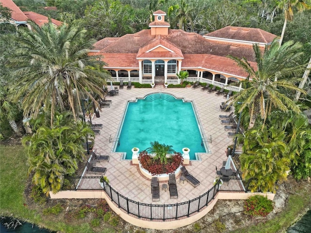 pool featuring a patio area and fence