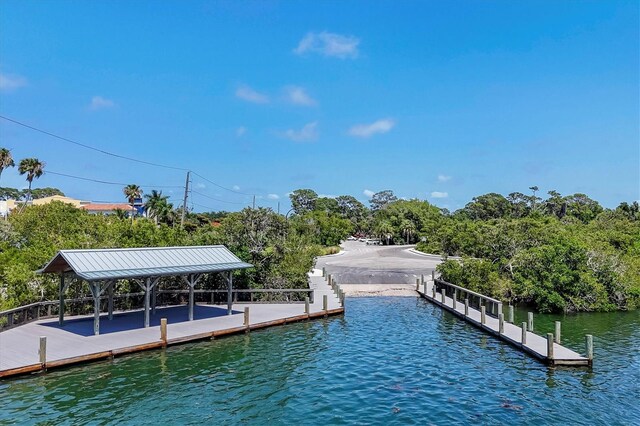 dock area featuring a gazebo and a water view