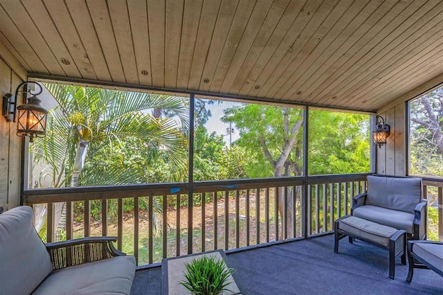 sunroom / solarium featuring wooden ceiling