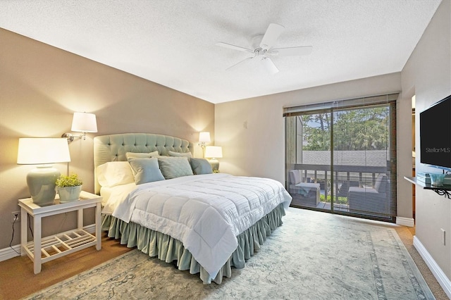 bedroom featuring a textured ceiling, ceiling fan, and access to outside