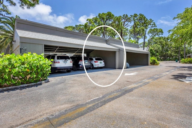 view of parking featuring a carport