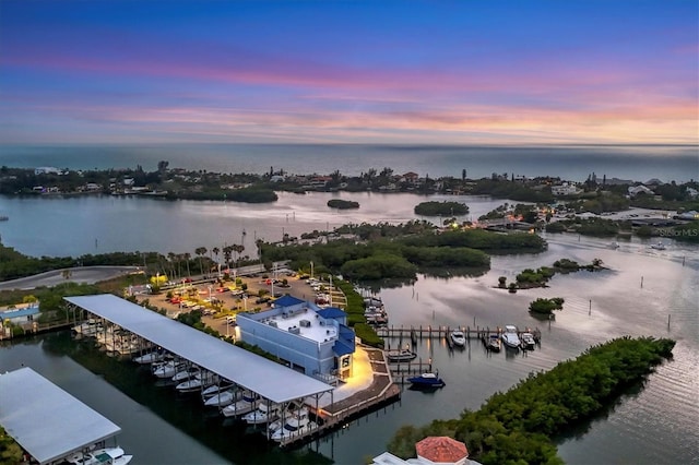 aerial view at dusk with a water view