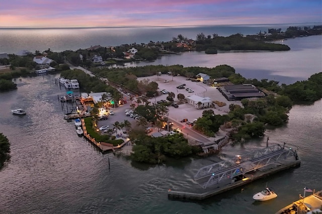 aerial view at dusk with a water view