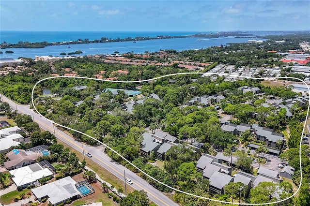 207 Woodland Dr Unit 207, Osprey, FL 34229 - aerial perspective of suburban area featuring a nearby body of water and a tree filled landscape