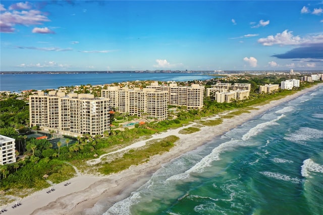 bird's eye view with a water view and a view of the beach