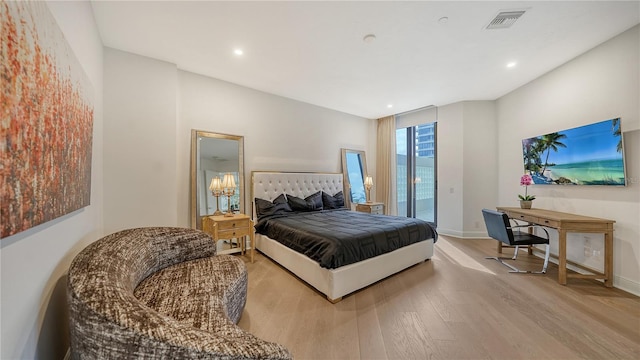 bedroom featuring light hardwood / wood-style flooring